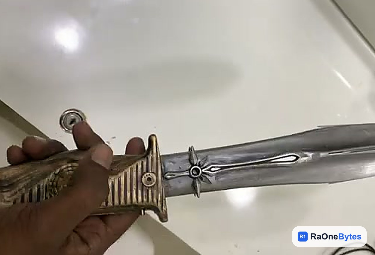 Finished villain knife movie prop held in hand